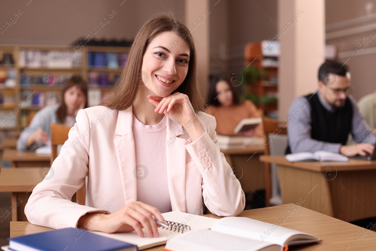 Photo of Portrait of smiling woman in public library