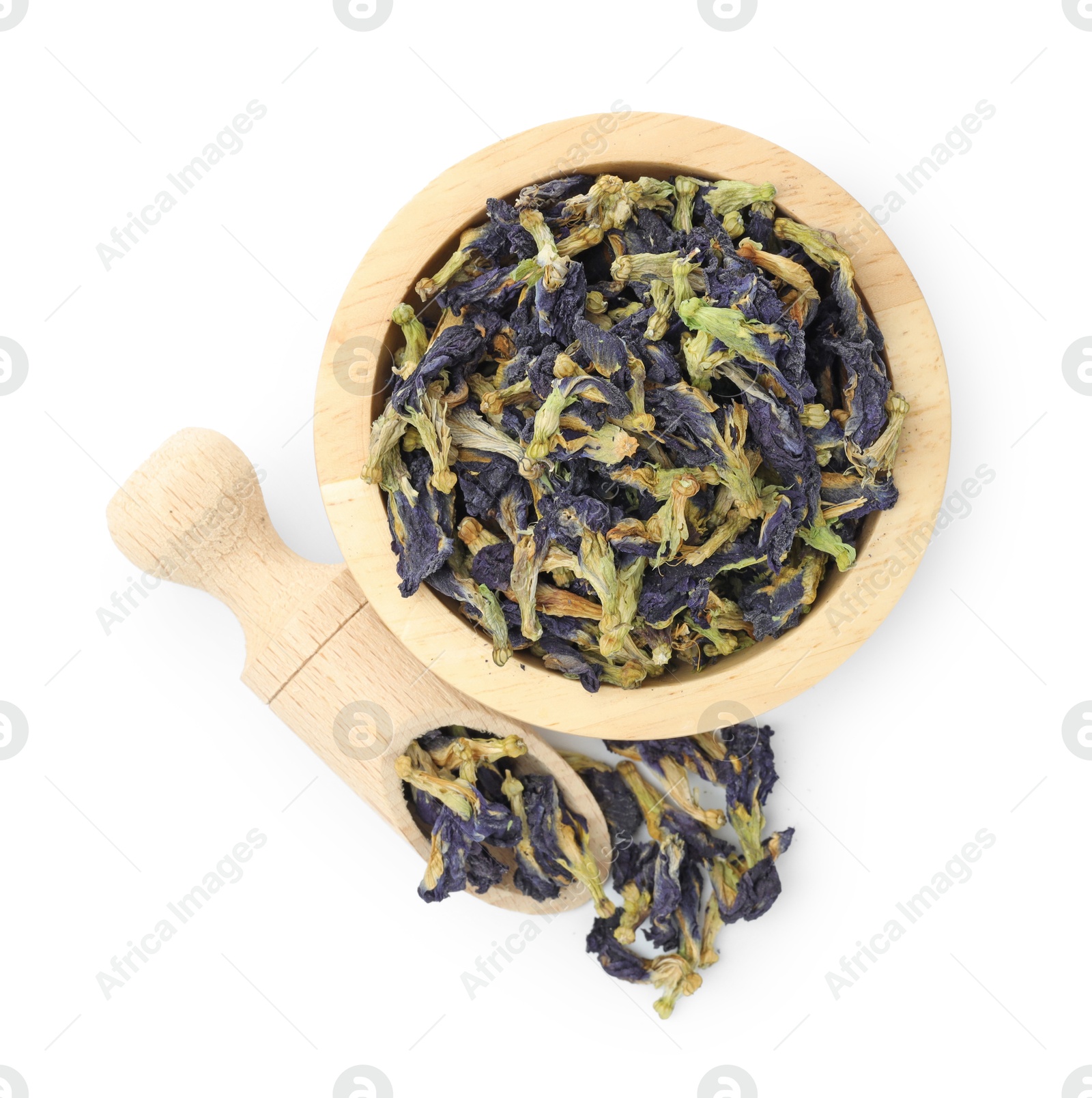 Photo of Butterfly pea flower tea. Dry Clitoria ternatea petals in bowl and scoop isolated on white, top view