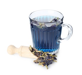 Photo of Fresh butterfly pea flower tea in cup and scoop with dry petals isolated on white