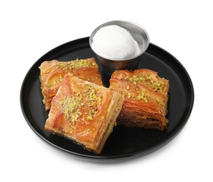 Photo of Delicious baklava with crushed nuts and ice cream isolated on white