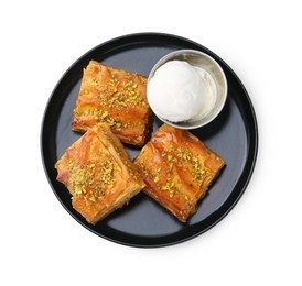 Photo of Delicious baklava with crushed nuts and ice cream isolated on white, top view