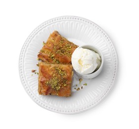 Photo of Delicious baklava with crushed nuts and ice cream isolated on white, top view