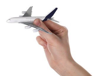 Photo of Woman with plane model on white background, closeup