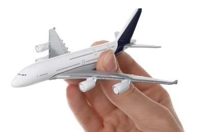 Photo of Woman with plane model on white background, closeup