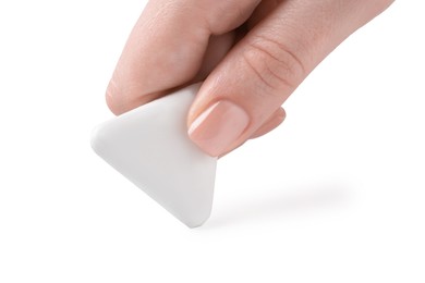 Photo of Woman using eraser on white background, closeup