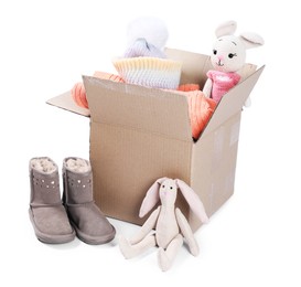 Photo of Different used clothes, toys and boots isolated on white