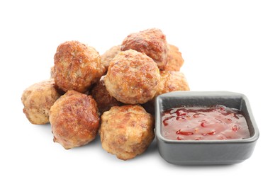 Photo of Pile of delicious meatballs and bowl with ketchup isolated on white