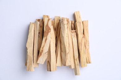 Photo of Palo santo sticks on white background, top view