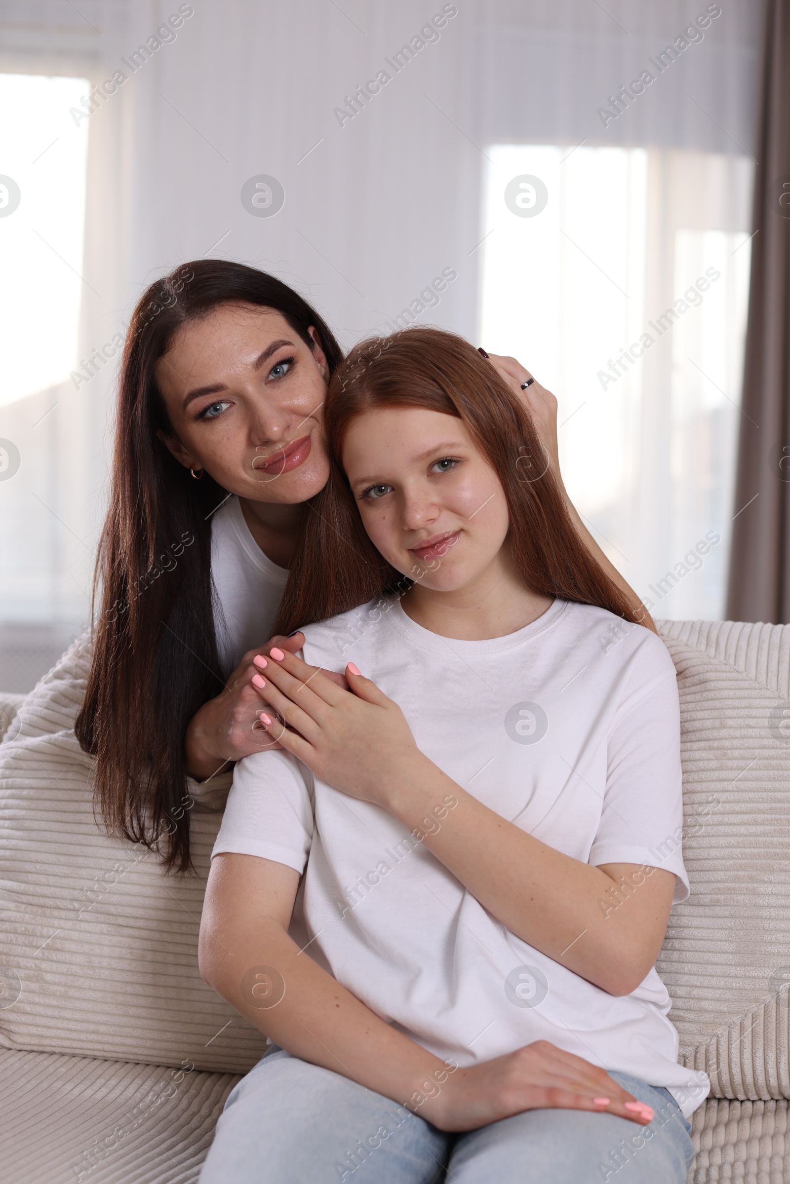 Photo of Portrait of beautiful mother with teenage daughter at home