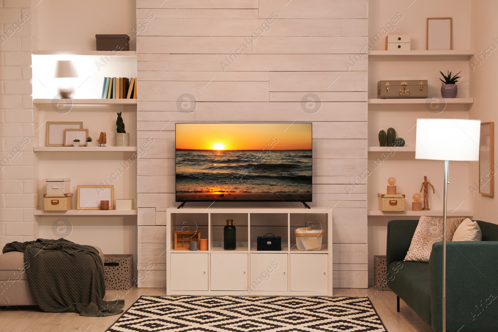 Image of TV set with nature landscape on screen in room