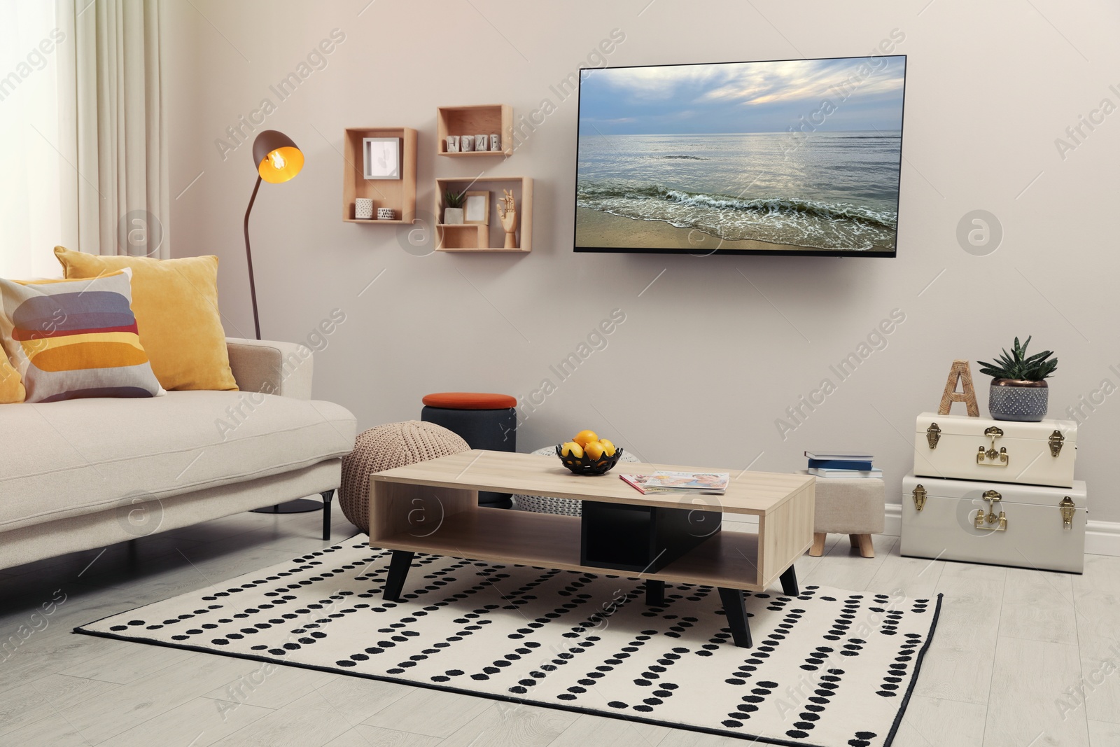 Image of TV set with nature landscape on screen in room