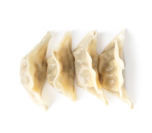 Photo of Tasty boiled gyoza (dumplings) isolated on white, top view