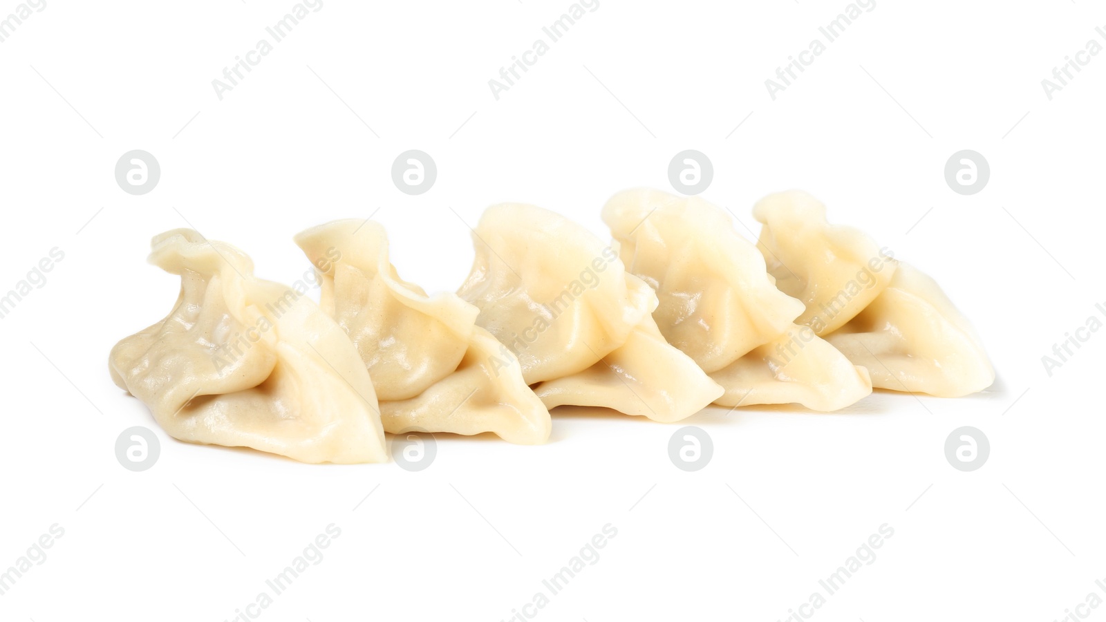 Photo of Tasty boiled gyoza (dumplings) isolated on white