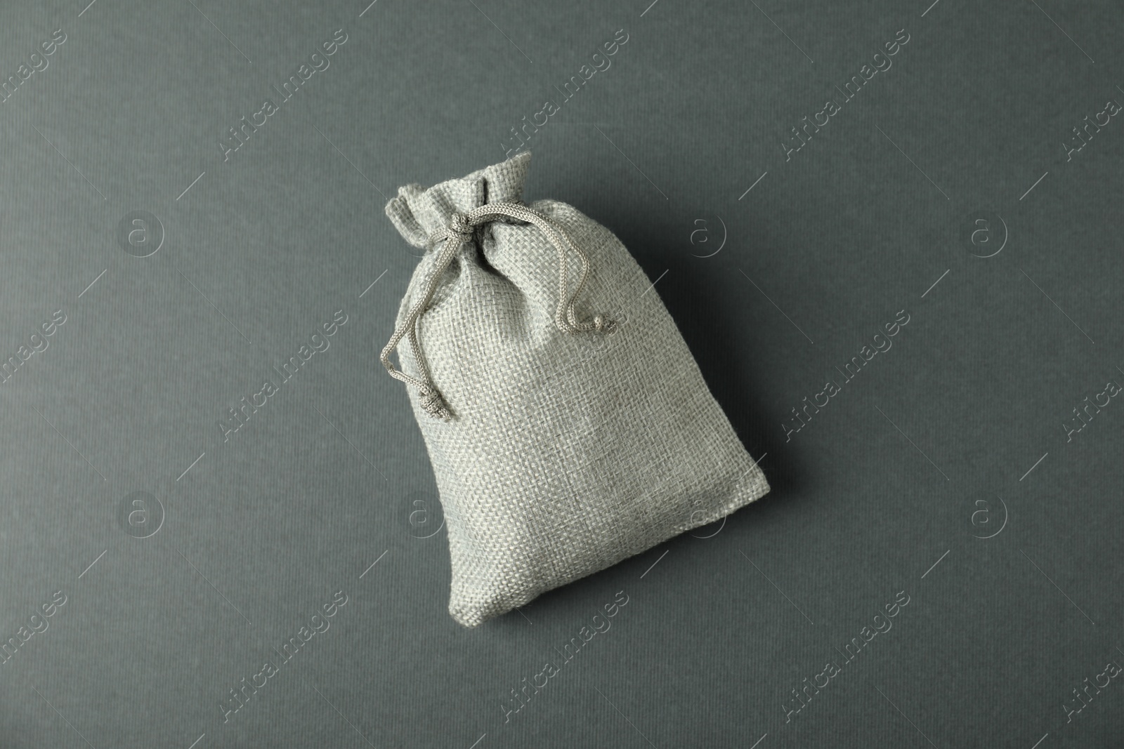 Photo of Burlap sack on gray background, top view