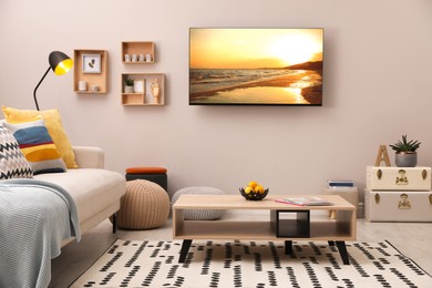 TV set with nature landscape on screen in room