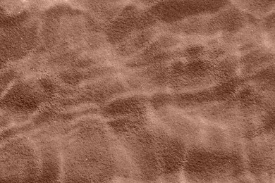 Image of Brown sand under water. Mocha mousse - color of 2025 year