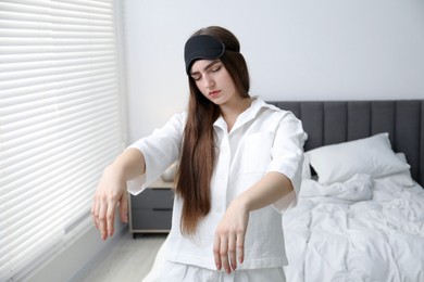 Photo of Young woman suffering from sleepwalking at home