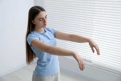 Photo of Young woman suffering from sleepwalking at home