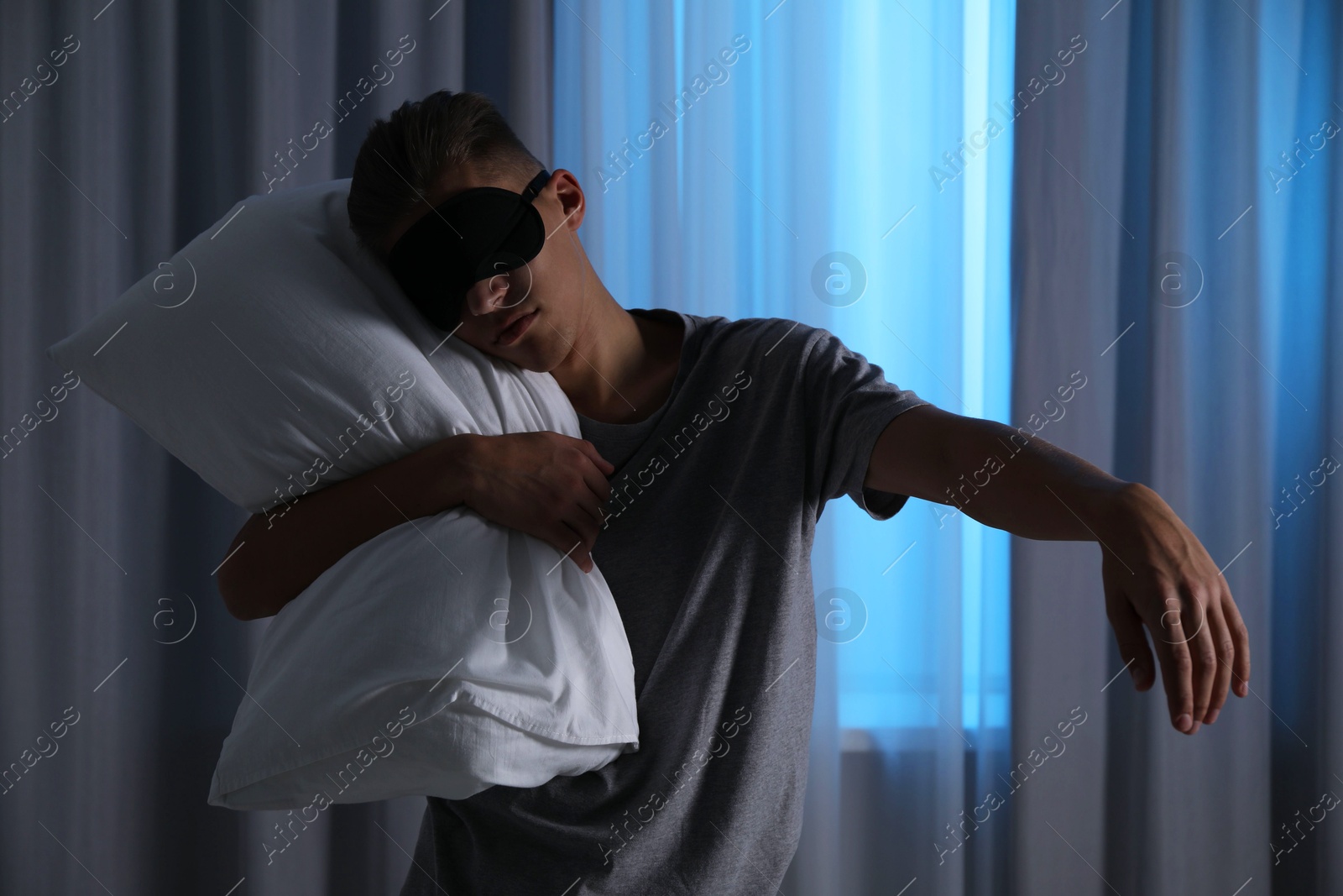 Photo of Young man suffering from sleepwalking at home