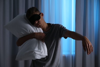 Photo of Young man suffering from sleepwalking at home