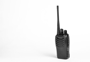 Photo of One walkie talkie on white background, space for text