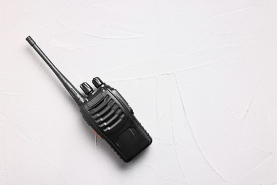 Photo of One walkie talkie on white table, top view. Space for text