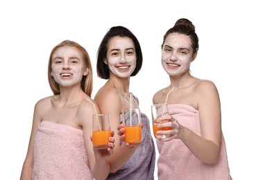 Photo of Spa day. Beautiful women with face masks and healthy drinks on white background