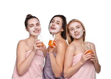 Photo of Spa day. Beautiful women with face masks and healthy drinks on white background