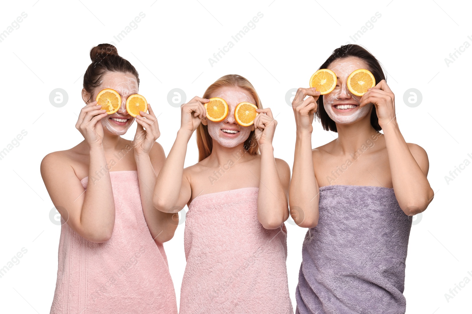 Photo of Spa day. Beautiful women with face masks and orange slices on white background