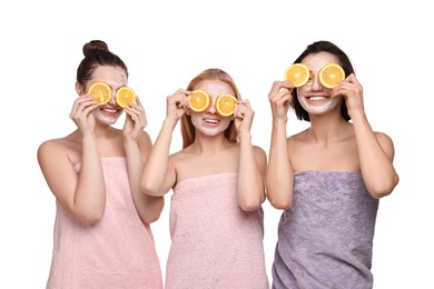 Photo of Spa day. Beautiful women with face masks and orange slices on white background