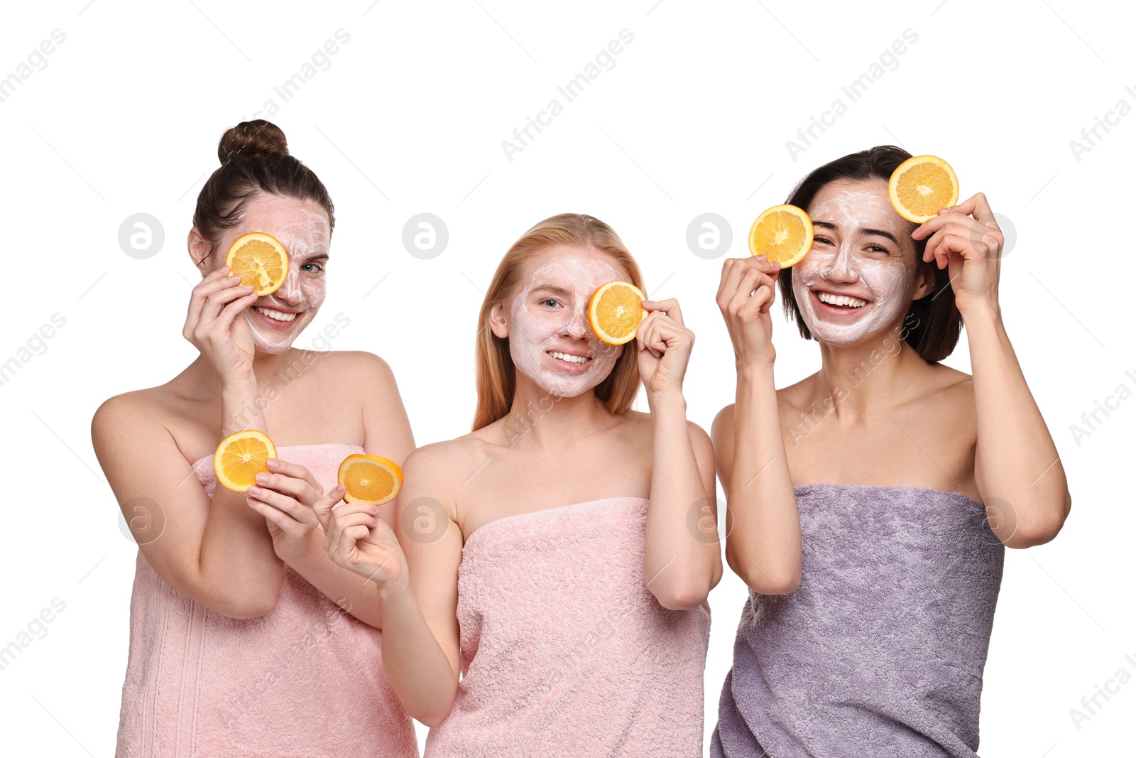 Photo of Spa day. Beautiful women with face masks and orange slices on white background