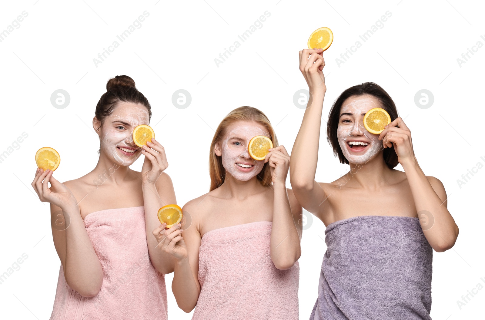 Photo of Spa day. Beautiful women with face masks and orange slices on white background