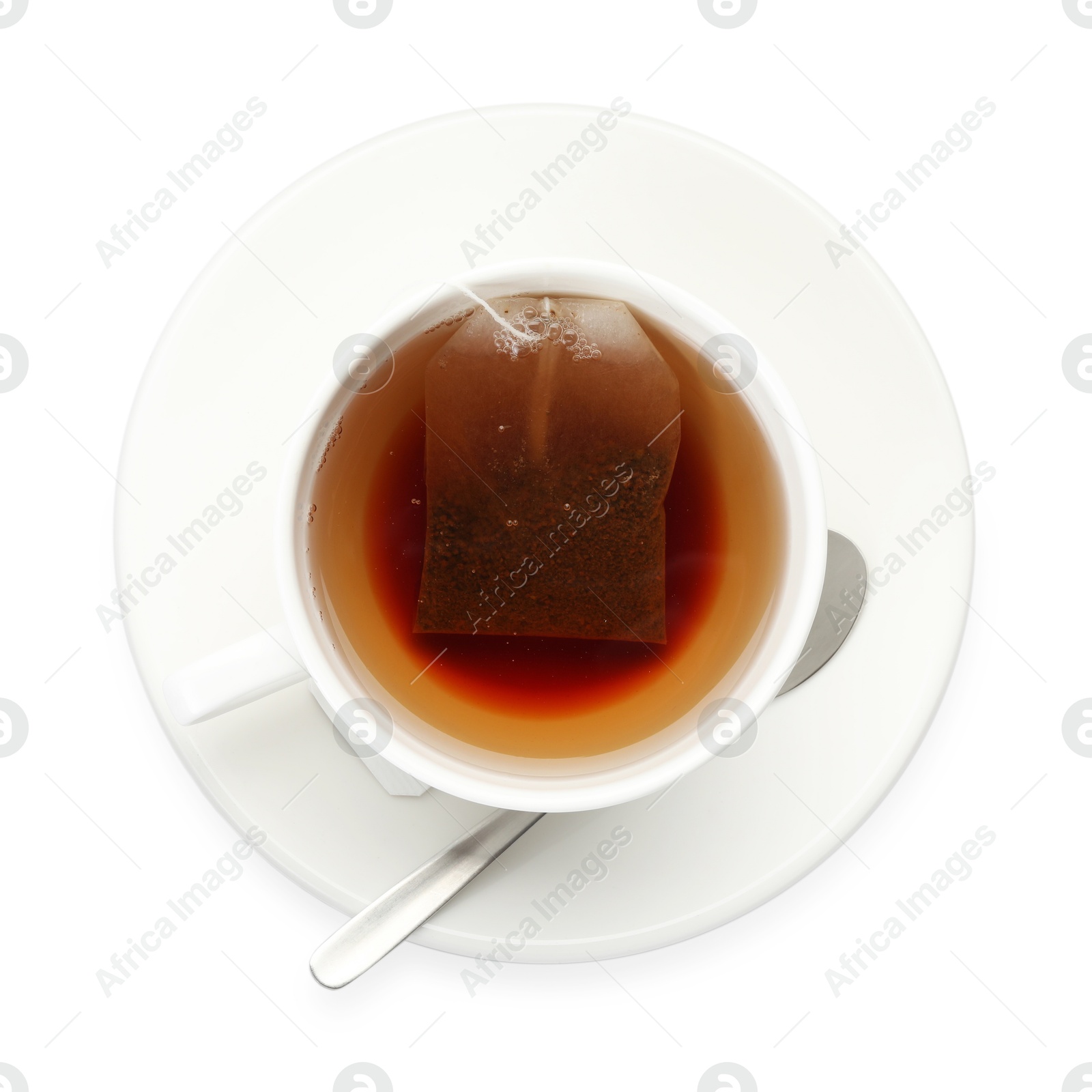 Photo of Tea bag in cup with hot drink isolated on white, top view