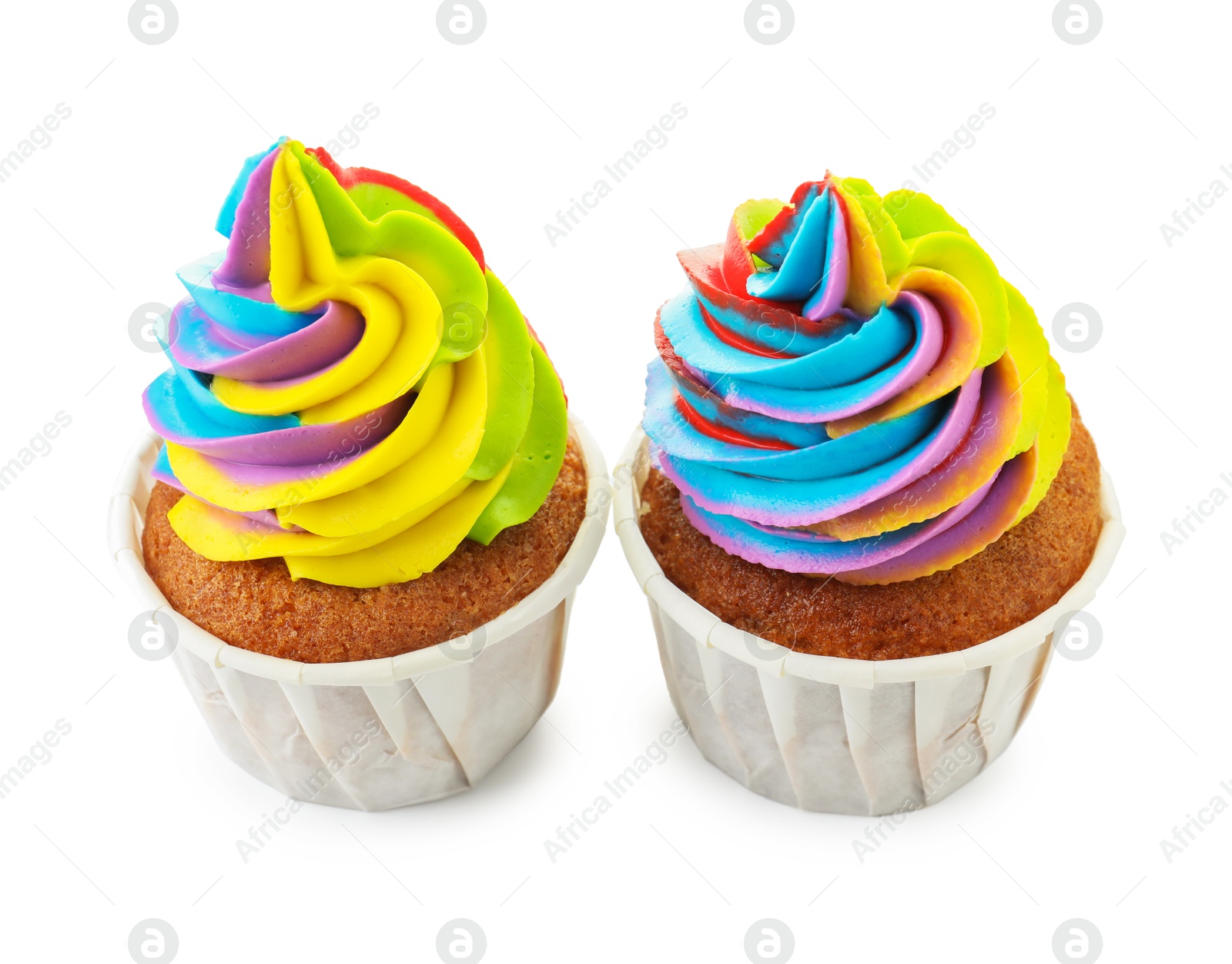 Photo of Tasty cupcakes with colorful cream isolated on white