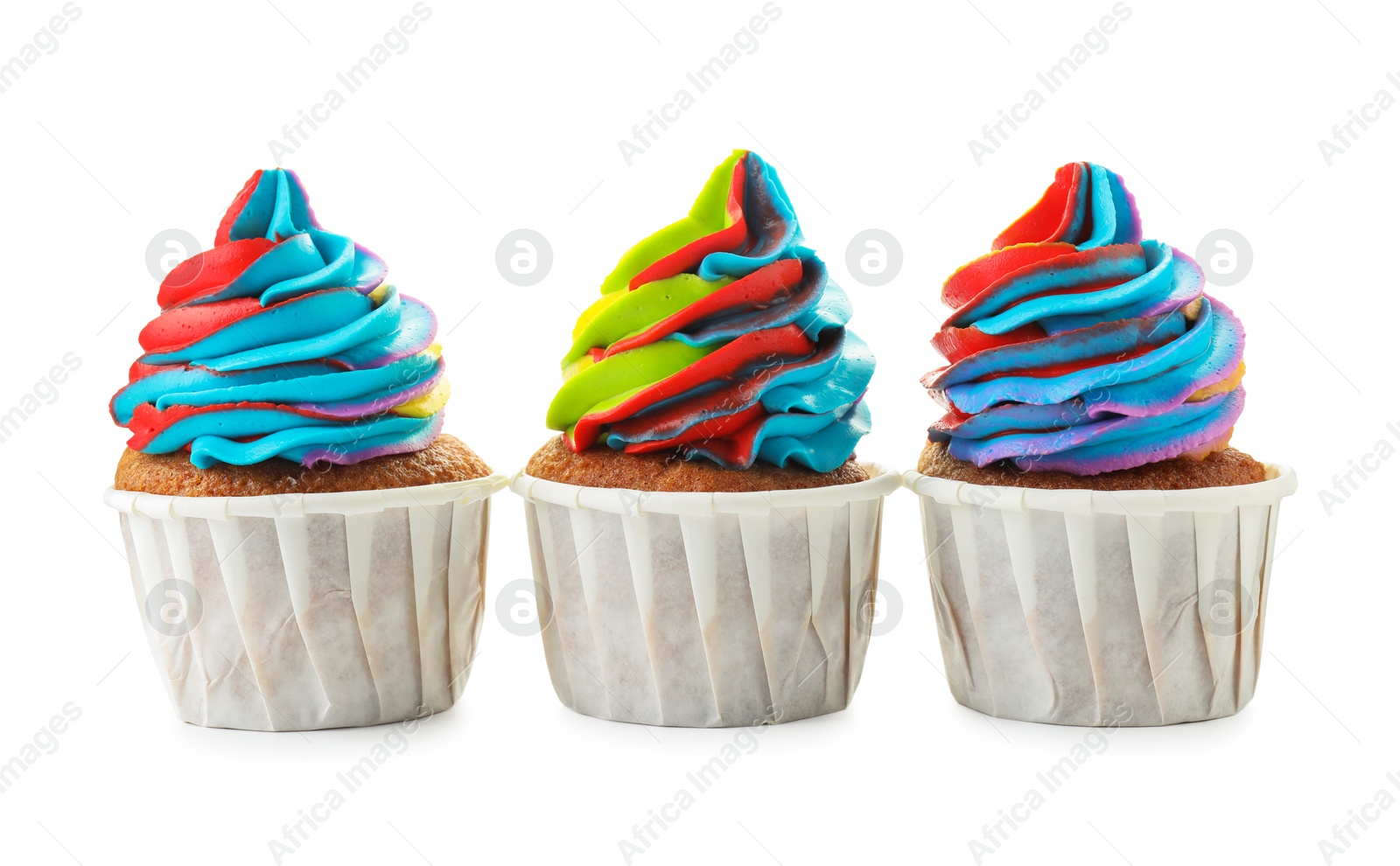 Photo of Tasty cupcakes with colorful cream isolated on white