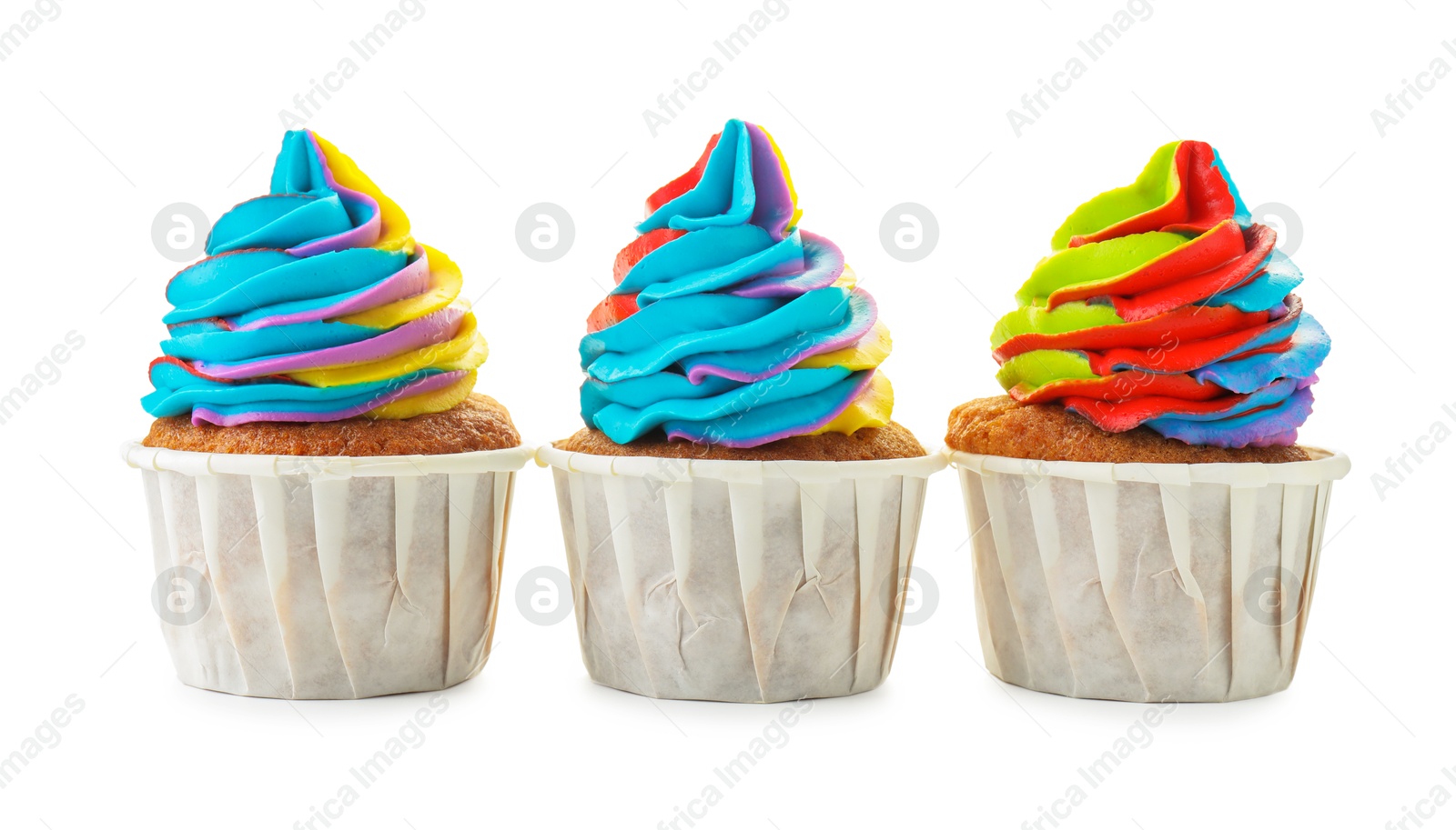 Photo of Tasty cupcakes with colorful cream isolated on white