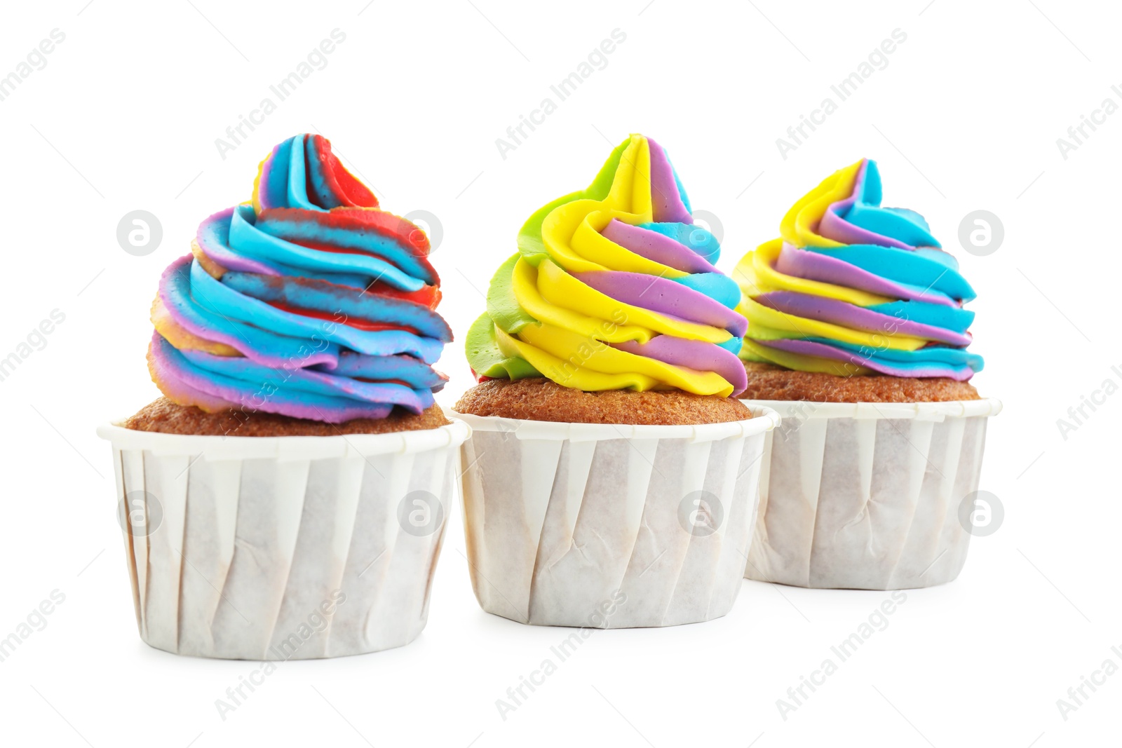 Photo of Tasty cupcakes with colorful cream isolated on white