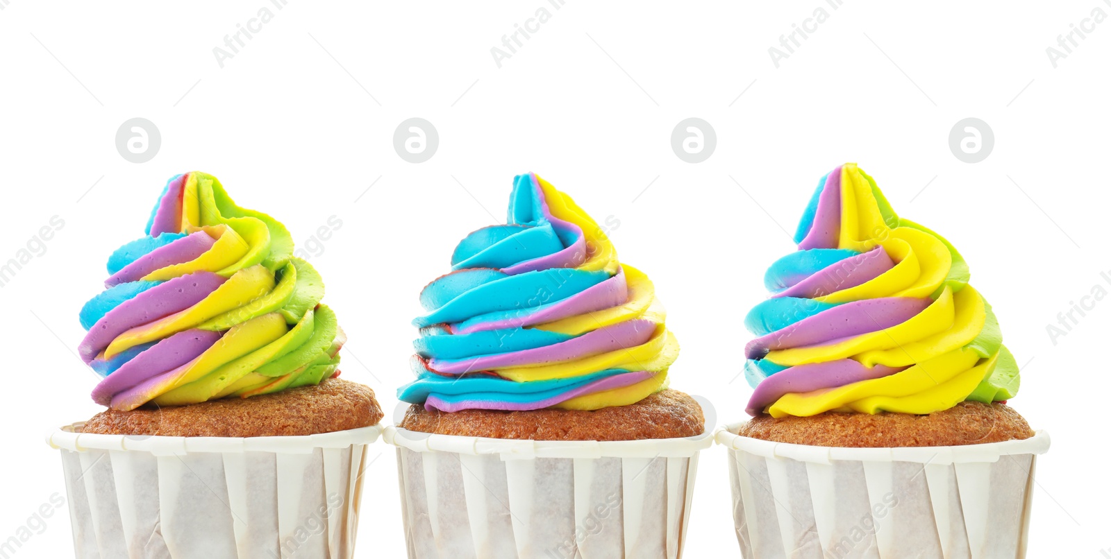 Photo of Tasty cupcakes with colorful cream isolated on white