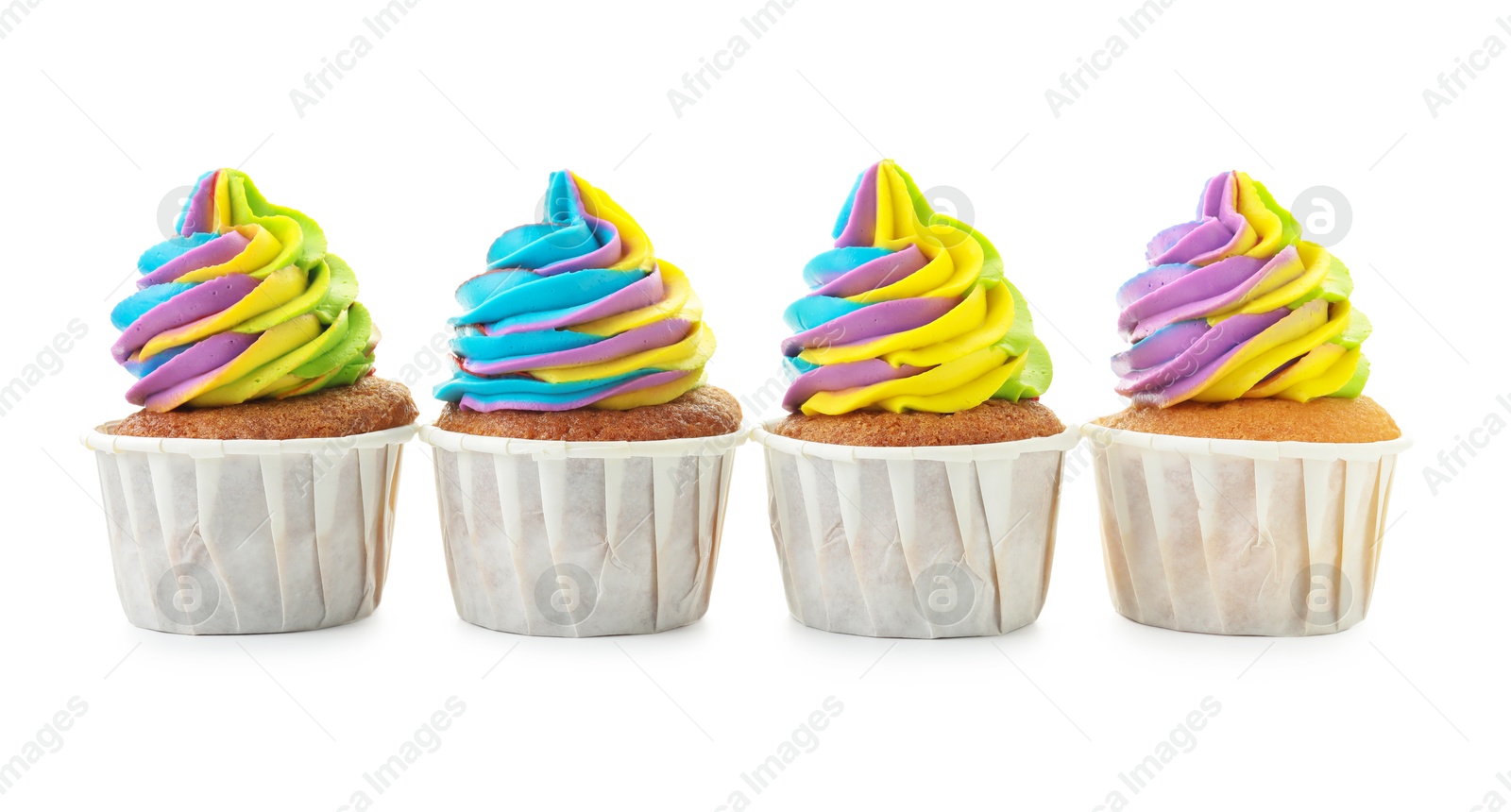 Photo of Tasty cupcakes with colorful cream isolated on white