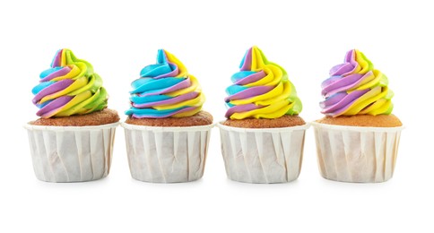 Photo of Tasty cupcakes with colorful cream isolated on white