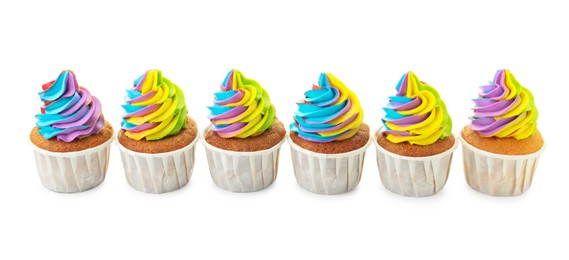 Photo of Tasty cupcakes with colorful cream isolated on white