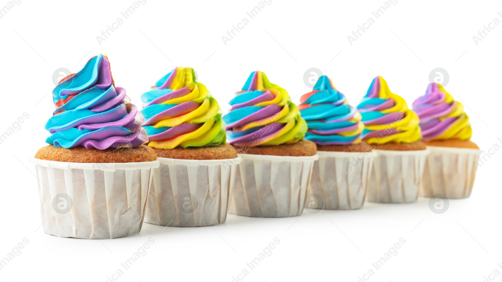 Photo of Tasty cupcakes with colorful cream isolated on white