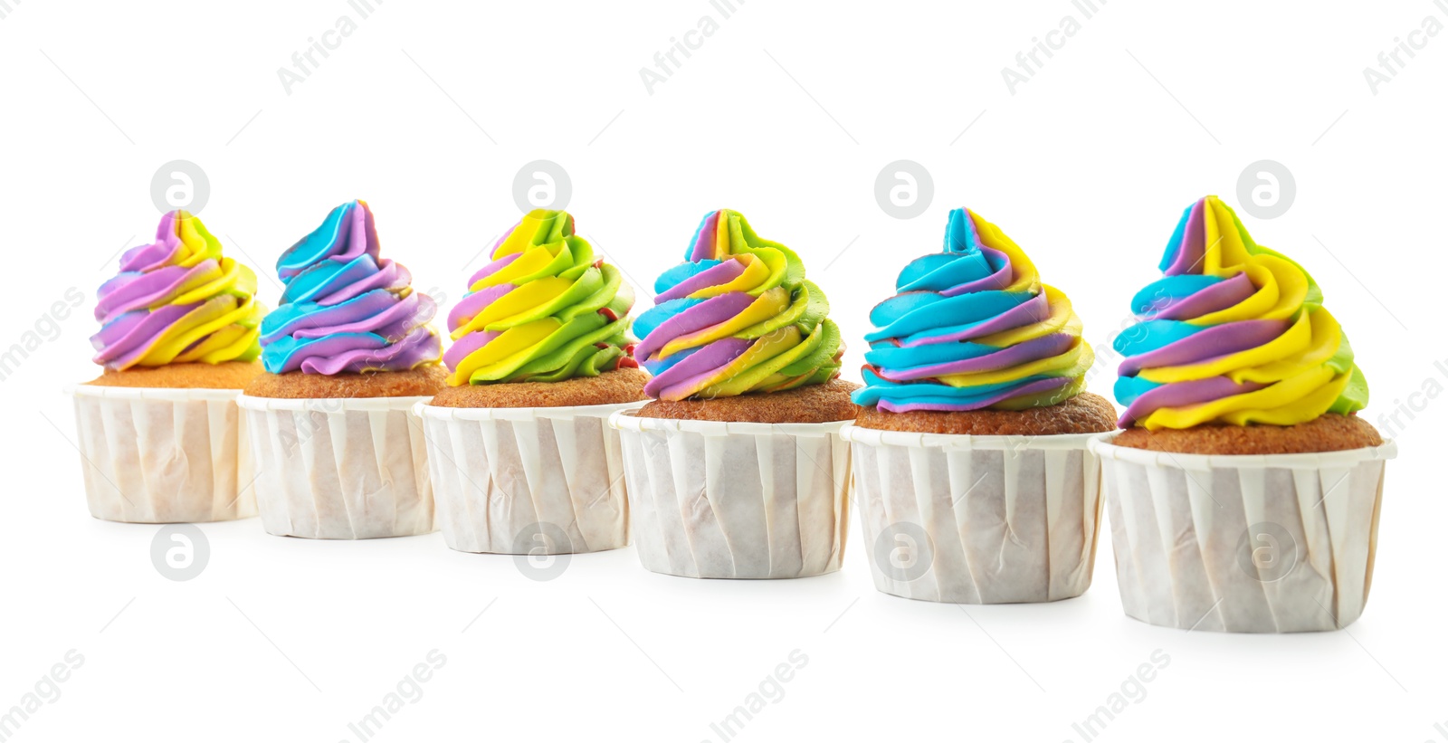 Photo of Tasty cupcakes with colorful cream isolated on white