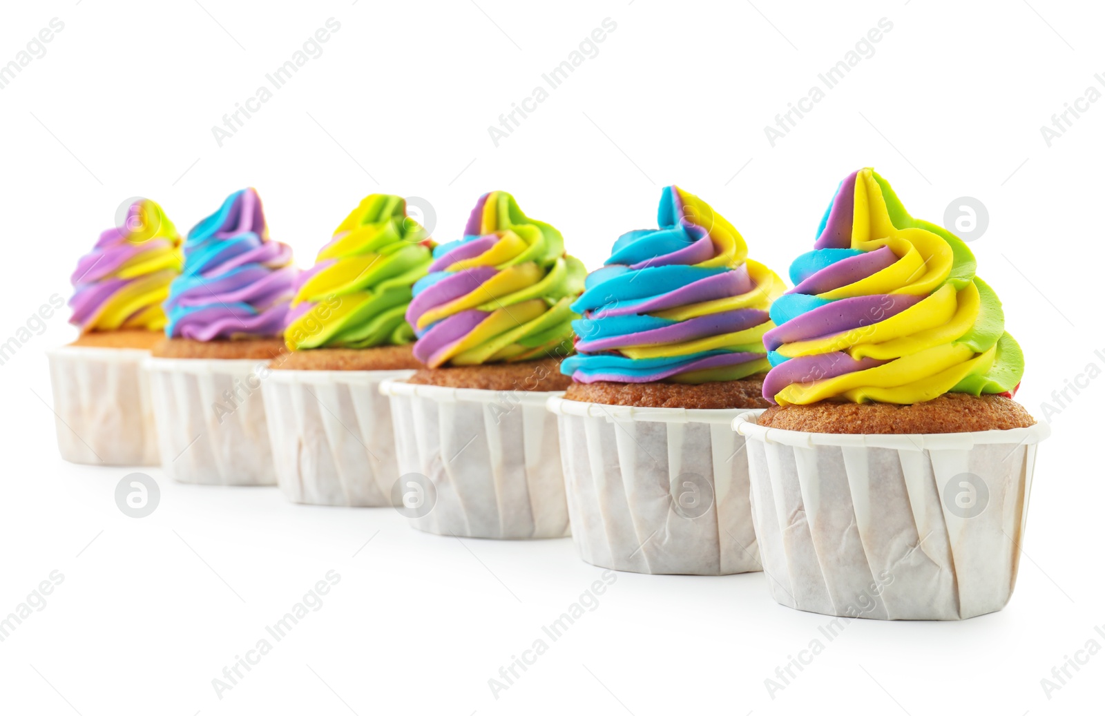 Photo of Tasty cupcakes with colorful cream isolated on white