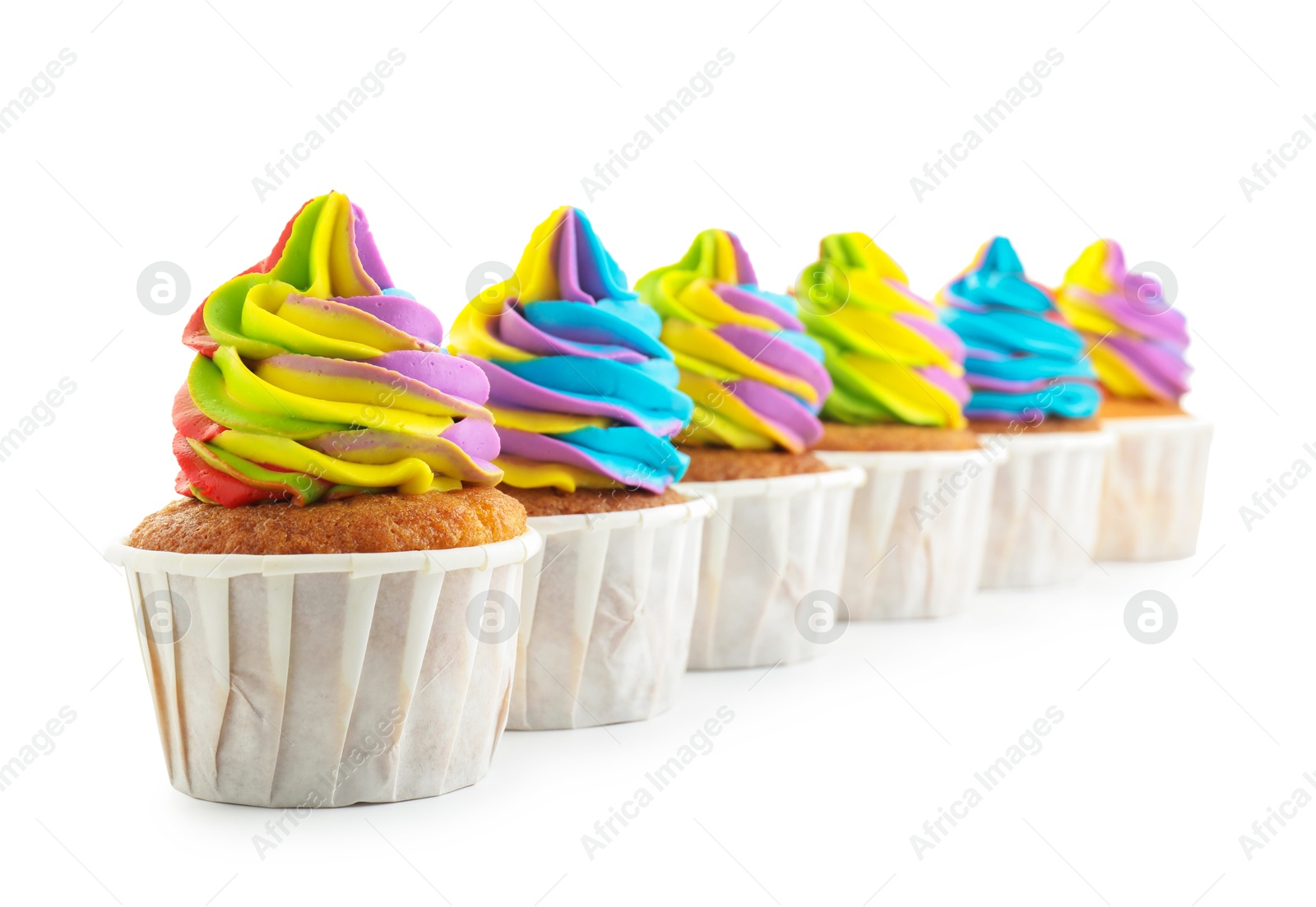 Photo of Tasty cupcakes with colorful cream isolated on white