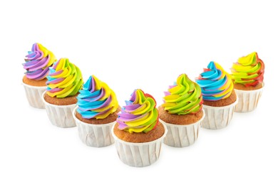 Photo of Tasty cupcakes with colorful cream isolated on white