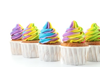 Photo of Tasty cupcakes with colorful cream on white background