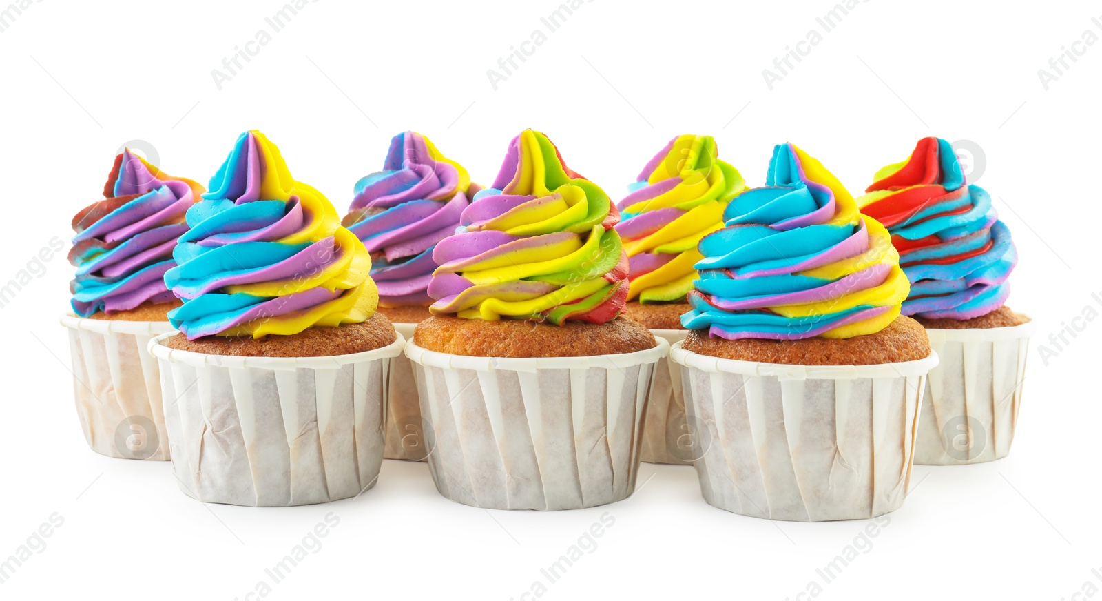 Photo of Tasty cupcakes with colorful cream isolated on white