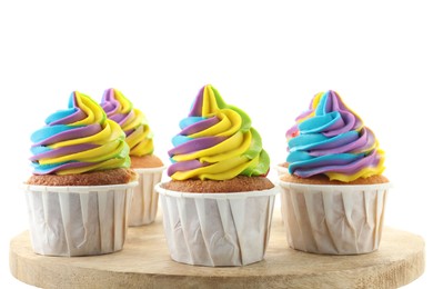 Tasty cupcakes with colorful cream on white background, closeup