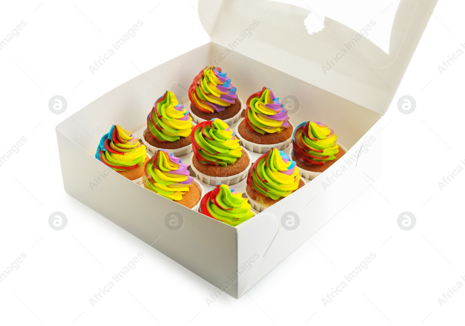 Photo of Tasty cupcakes with colorful cream in box isolated on white